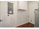 Bright laundry room with washer/dryer hookups and built-in cabinets at 2256 Barge Sw Rd, Atlanta, GA 30331