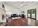 Spacious living room with dark hardwood floors, a fireplace, and French doors at 2256 Barge Sw Rd, Atlanta, GA 30331