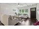 Bright living room with hardwood floors, neutral colors, and a ceiling fan at 2256 Barge Sw Rd, Atlanta, GA 30331