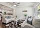 Open concept living room and kitchen with dark hardwood floors and a ceiling fan at 2256 Barge Sw Rd, Atlanta, GA 30331