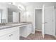 Double vanity bathroom with granite countertop and tile floor at 526 Bass Pointe Nw, Kennesaw, GA 30144