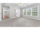 Large main bedroom with carpet, ceiling fan and access to bathroom at 526 Bass Pointe Nw, Kennesaw, GA 30144