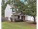 Two-story house with a two-car garage and large tree at 526 Bass Pointe Nw, Kennesaw, GA 30144