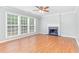 Spacious living room with hardwood floors and fireplace at 526 Bass Pointe Nw, Kennesaw, GA 30144