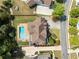 Aerial view of house, pool, and surrounding landscape at 5585 Lavender Farms Rd, Powder Springs, GA 30127