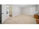 Spacious finished basement room with carpet and extra storage at 5585 Lavender Farms Rd, Powder Springs, GA 30127