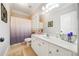 Well-lit bathroom with bathtub and vanity at 5585 Lavender Farms Rd, Powder Springs, GA 30127