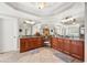 Bathroom boasts double vanities, a large mirror, and tile flooring at 5585 Lavender Farms Rd, Powder Springs, GA 30127