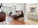 Main bedroom with ensuite bathroom and hardwood floors at 5585 Lavender Farms Rd, Powder Springs, GA 30127