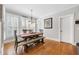 Breakfast nook with hardwood floors, bench seating, and window shutters at 5585 Lavender Farms Rd, Powder Springs, GA 30127