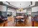 Formal dining room with hardwood floors, wainscoting, and chandelier at 5585 Lavender Farms Rd, Powder Springs, GA 30127