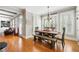 Bright dining room features hardwood floors, built-in bench seating, and a view to the living room at 5585 Lavender Farms Rd, Powder Springs, GA 30127