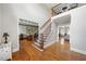 Bright entryway with hardwood floors and open view to living area at 5585 Lavender Farms Rd, Powder Springs, GA 30127