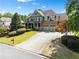 Two story home with stone and green accents at 5585 Lavender Farms Rd, Powder Springs, GA 30127