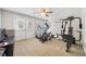 Basement home gym with equipment and outside access at 5585 Lavender Farms Rd, Powder Springs, GA 30127