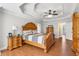 Main bedroom with hardwood floors, tray ceiling, and wood furniture at 5585 Lavender Farms Rd, Powder Springs, GA 30127