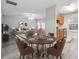 Dining area with staged furniture and kitchen view at 6235 Queen Meadow Se Dr, Mableton, GA 30126