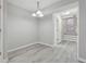 Simple dining area with gray walls and wood-look floors at 6235 Queen Meadow Se Dr, Mableton, GA 30126