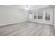 Spacious living room with gray walls and wood-look floors at 6235 Queen Meadow Se Dr, Mableton, GA 30126