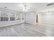 Open living space with gray walls and wood-look floors at 6235 Queen Meadow Se Dr, Mableton, GA 30126