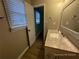 Bathroom with granite vanity and view of hallway at 1921 Clinton Pl, Lawrenceville, GA 30043