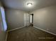 Spacious bedroom with neutral carpeting and double doors at 1921 Clinton Pl, Lawrenceville, GA 30043