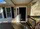 Inviting front entrance with a dark door and a wooden deck at 1921 Clinton Pl, Lawrenceville, GA 30043