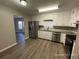 Modern kitchen with stainless steel appliances and white cabinets at 1921 Clinton Pl, Lawrenceville, GA 30043