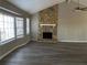 Vaulted ceiling living room with stone fireplace and hardwood floors at 1921 Clinton Pl, Lawrenceville, GA 30043