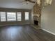 Bright living room featuring a stone fireplace and hardwood floors at 1921 Clinton Pl, Lawrenceville, GA 30043