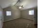 Spacious main bedroom with high ceiling, ceiling fan, and carpet flooring at 1921 Clinton Pl, Lawrenceville, GA 30043