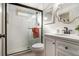 Small bathroom with white vanity, walk-in shower and subway tile at 2082 Greenway Mill Ct, Snellville, GA 30078