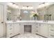 Elegant bathroom with double vanity, large mirror, and plenty of counter space at 2082 Greenway Mill Ct, Snellville, GA 30078