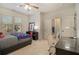 Well-lit bedroom with en-suite bathroom and built-in desk at 2082 Greenway Mill Ct, Snellville, GA 30078