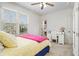 Bedroom with yellow bedding, white desk and built-in closet at 2082 Greenway Mill Ct, Snellville, GA 30078