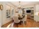 Bright breakfast nook features hardwood floors and a view into Gathering room at 2082 Greenway Mill Ct, Snellville, GA 30078