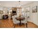 Bright breakfast nook features hardwood floors and a charming round table at 2082 Greenway Mill Ct, Snellville, GA 30078