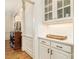 Well-appointed butler's pantry with white cabinetry and quartz countertops at 2082 Greenway Mill Ct, Snellville, GA 30078