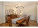 Formal dining room with hardwood floors, chandelier, and sideboard at 2082 Greenway Mill Ct, Snellville, GA 30078