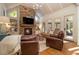 Cozy Gathering room with stone fireplace, built-in shelving, and hardwood floors at 2082 Greenway Mill Ct, Snellville, GA 30078