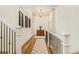 Bright hallway with hardwood floors and stylish light fixture at 2082 Greenway Mill Ct, Snellville, GA 30078