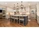 Modern kitchen featuring white cabinets, a blue island, and pendant lighting at 2082 Greenway Mill Ct, Snellville, GA 30078