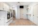 Spacious laundry room with washer, dryer, and built-in cabinets at 2082 Greenway Mill Ct, Snellville, GA 30078