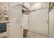 Laundry room with built-in storage, a bench, and patterned tile floors at 2082 Greenway Mill Ct, Snellville, GA 30078