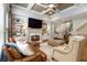 Bright living room features a fireplace, built-in shelving, and hardwood floors at 2082 Greenway Mill Ct, Snellville, GA 30078