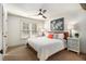 Bright main bedroom with cozy bedding, world map art, and ceiling fan at 2082 Greenway Mill Ct, Snellville, GA 30078