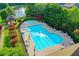 Aerial view of community pool, including a separate kiddie pool and landscaping at 2082 Greenway Mill Ct, Snellville, GA 30078