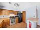 Functional kitchen with stainless steel appliances and wood cabinets at 285 Independence Dr, Jonesboro, GA 30238