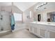 Main bathroom with double vanity and soaking tub at 311 Tuggle Ct, Woodstock, GA 30188