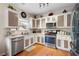 Well-equipped kitchen with stainless steel appliances and light wood cabinets at 311 Tuggle Ct, Woodstock, GA 30188